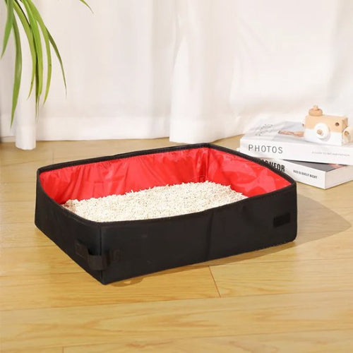 bac à litière chat transportable rouge salon
