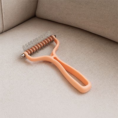 brosse pour chat demele nœuds rose saumon