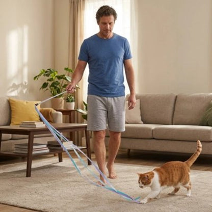 jouet chat baguette a ruban violet maitre chat jouant
